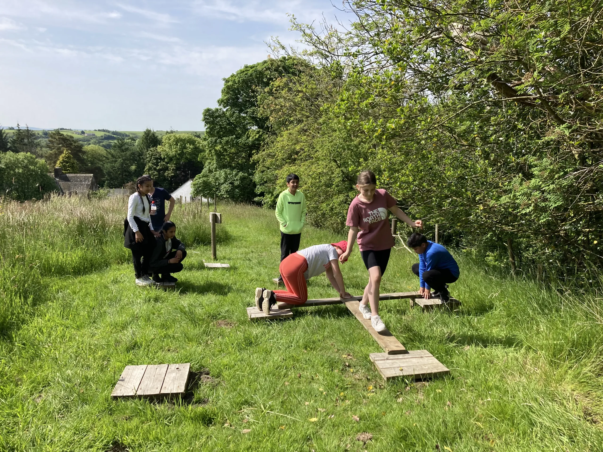 Children doing problem solving in a field