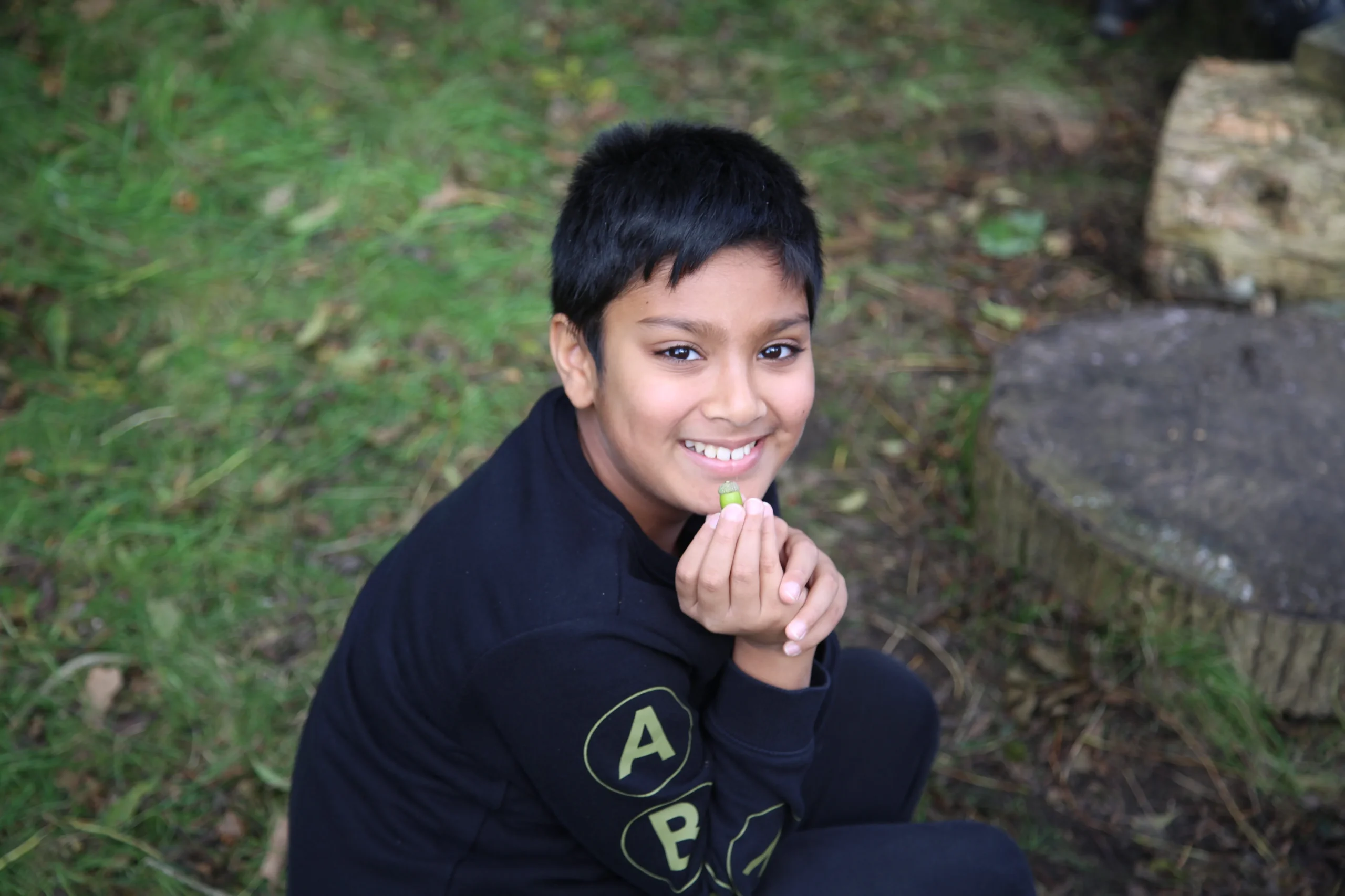 Child posing with leaf